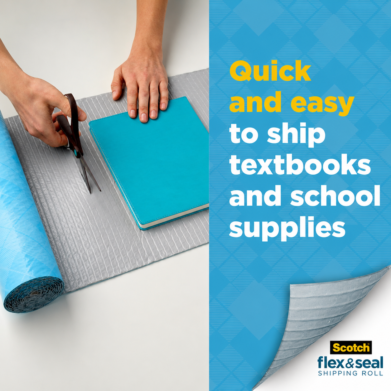 A hand cutting the material to size with scissors around a blue notebook resting on the grey inner face, beside a partly unrolled roll.