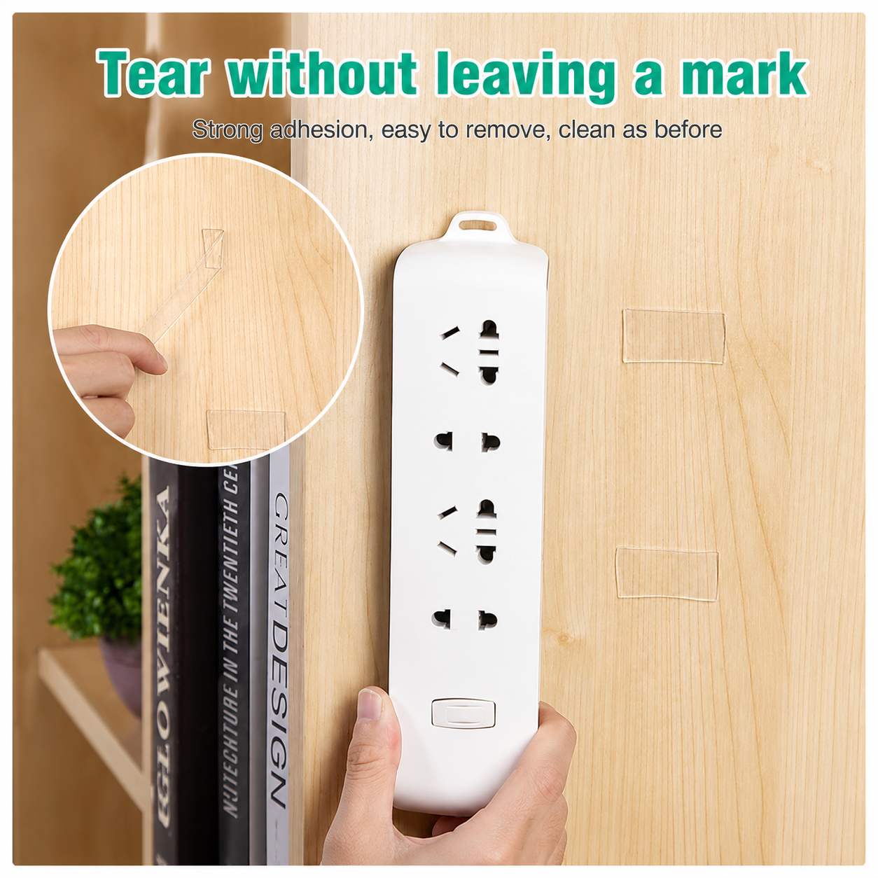 A power socket strip held on a wooden cabinet by two clear tape pads, with a close up of a pad being lifted away leaving no mark.