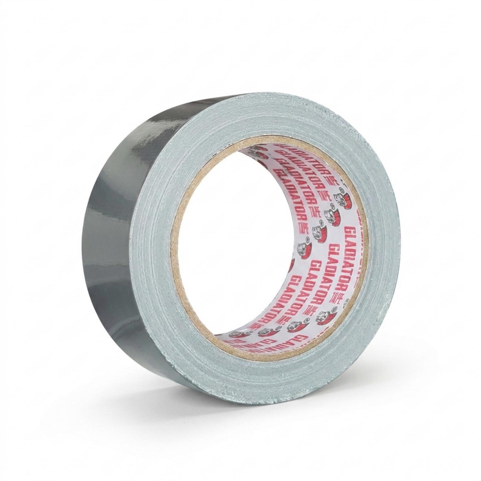 A roll of silver cloth tape resting on its side, the light catching the woven surface and the branded core facing the camera.