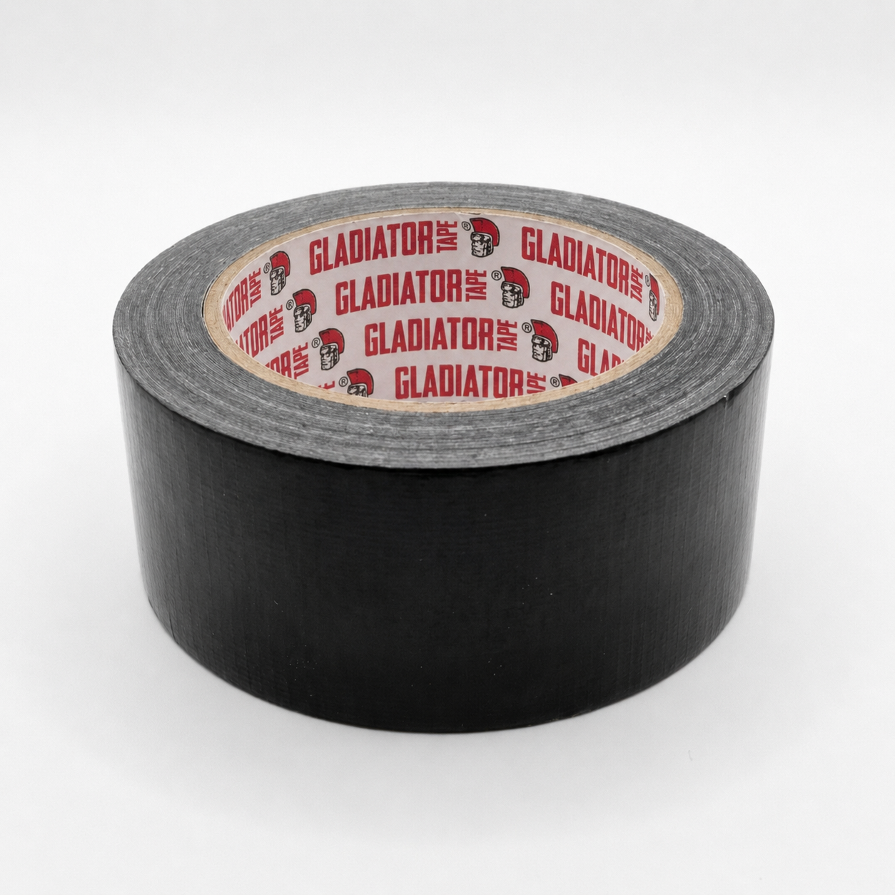 A roll of black cloth tape from slightly above, the matt woven surface across its width and the red printed core facing up.