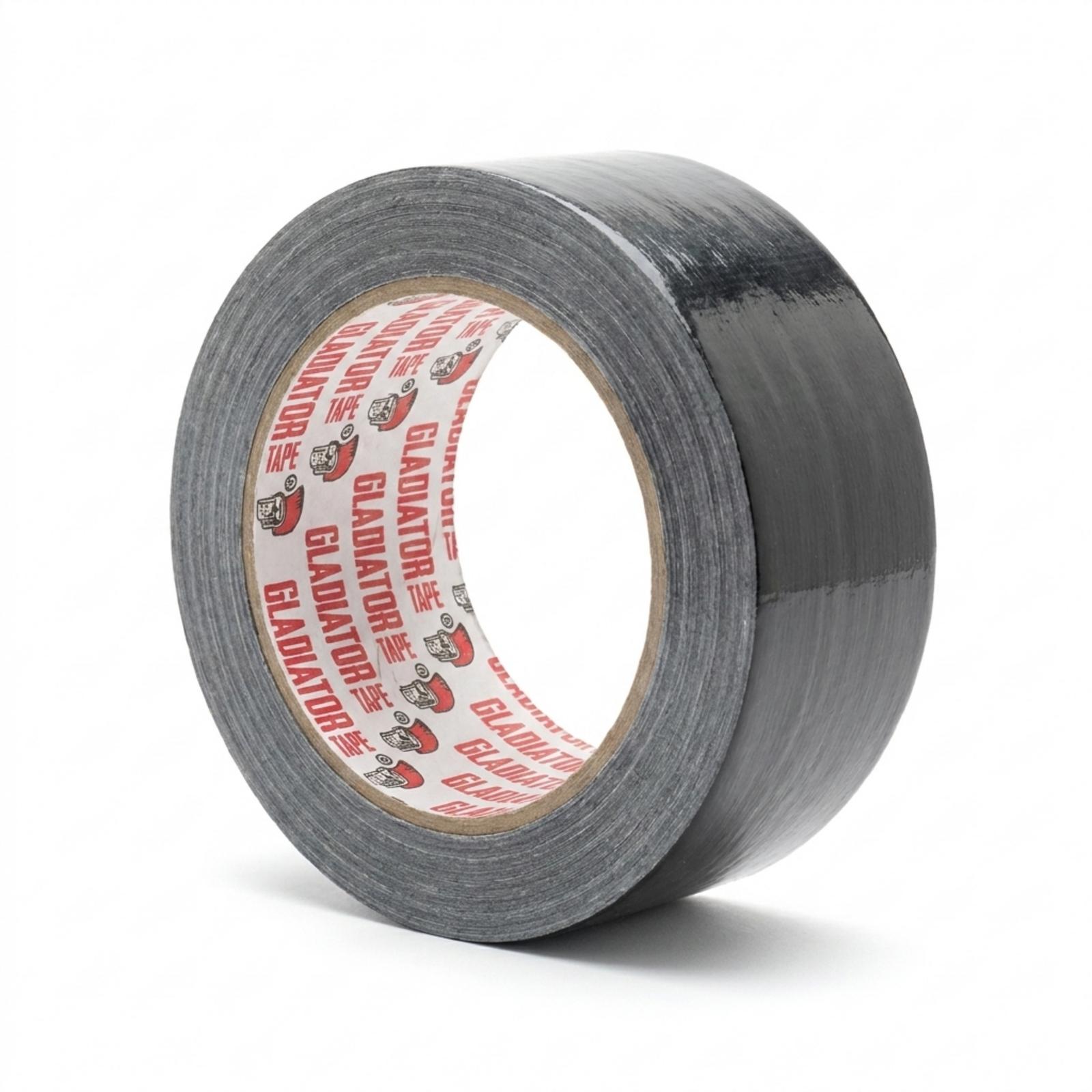 A roll of black cloth tape resting on its side, the light catching a glossy band across the weave, with the branded core facing the camera.