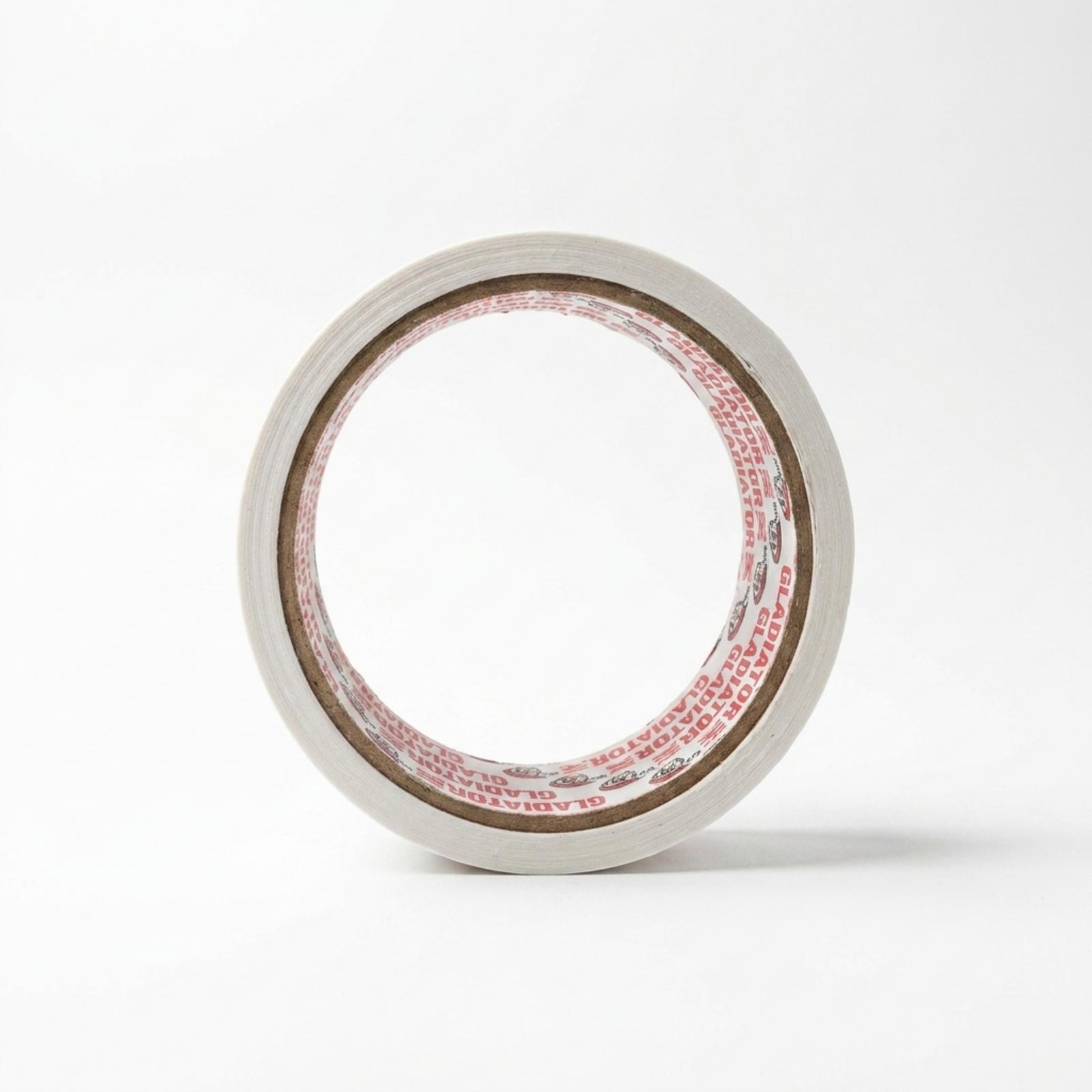 A roll of white cloth tape stood on edge, face on, the cardboard core lined with red Gladiator branding visible through the middle.